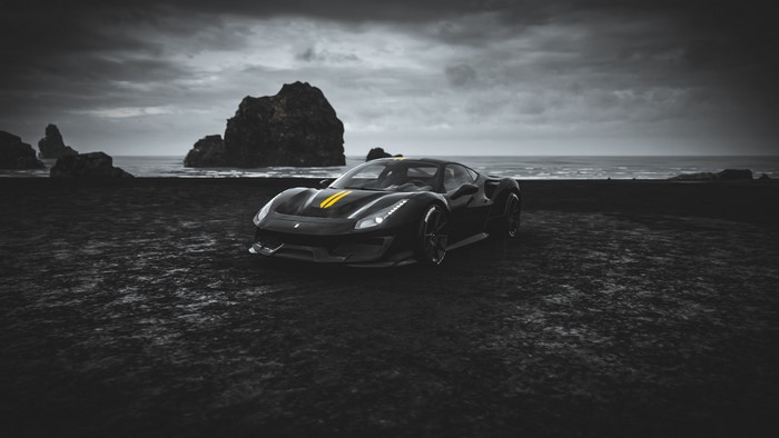 Black Ferrari 488 Pista with yellow stripes on a beach