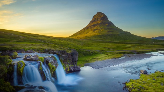 Kirkjufell mountain and waterfall in Iceland at sunset