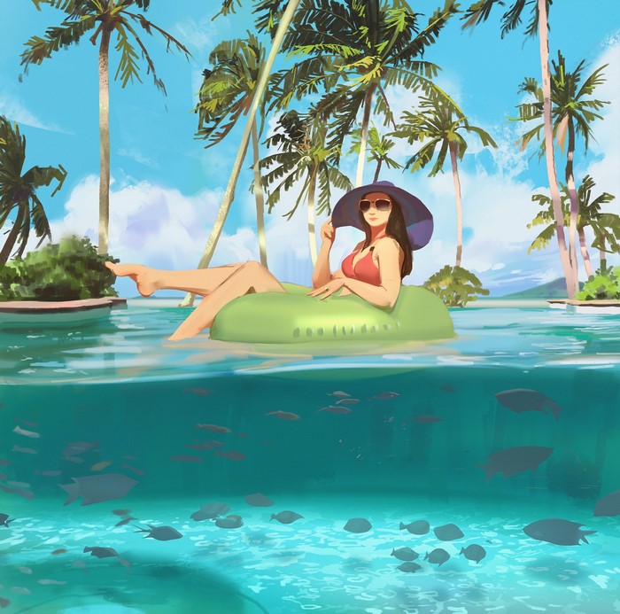 Woman relaxing on an inflatable tube in a tropical pool