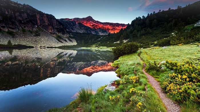 Mountain lake reflection at sunset in Pirin Mountains, Bulgaria