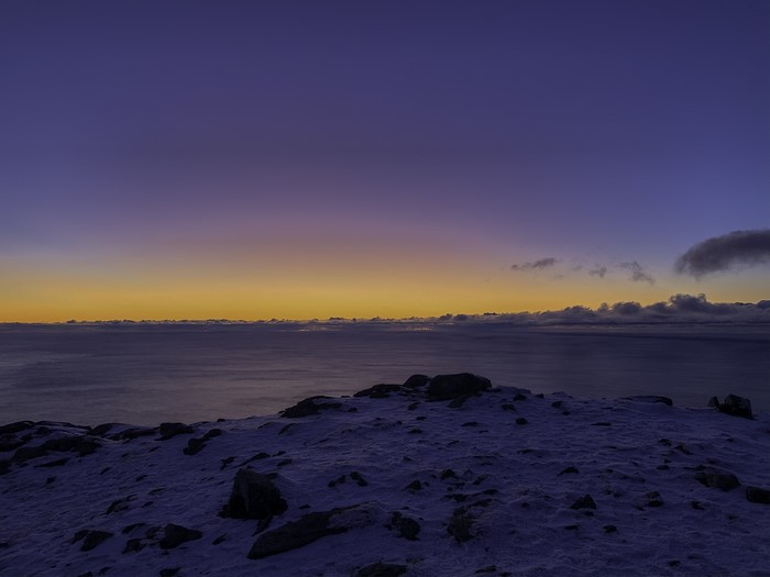 Winter landscape with ocean and twilight sky in Norway
