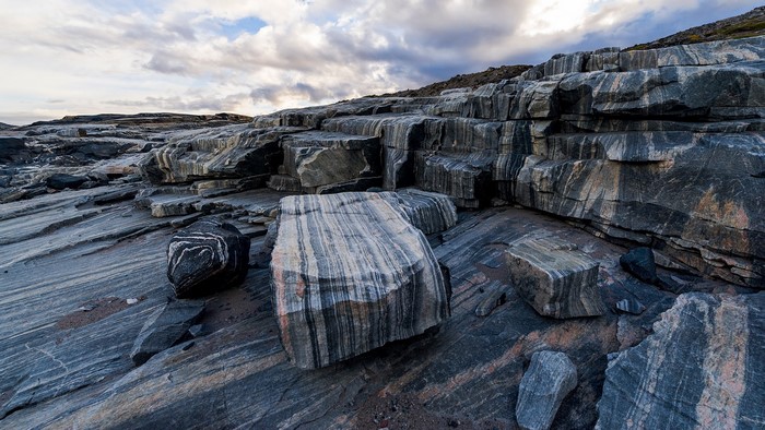 Layered rocks and cloudy sky at Isua Greenstone Belt, Greenland