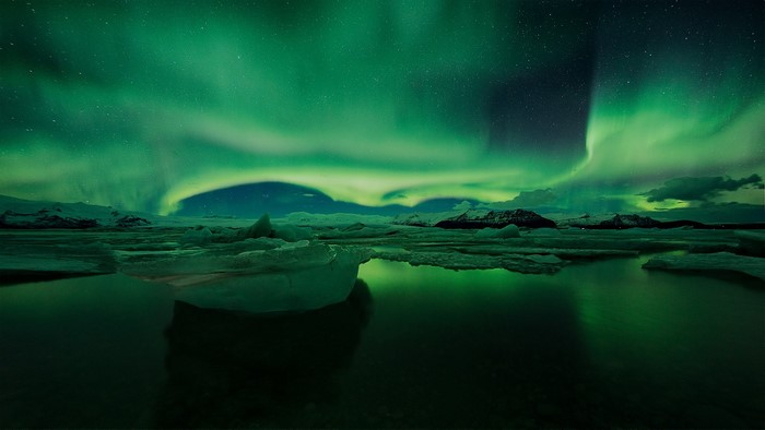 Aurora Borealis over icebergs in Iceland at night