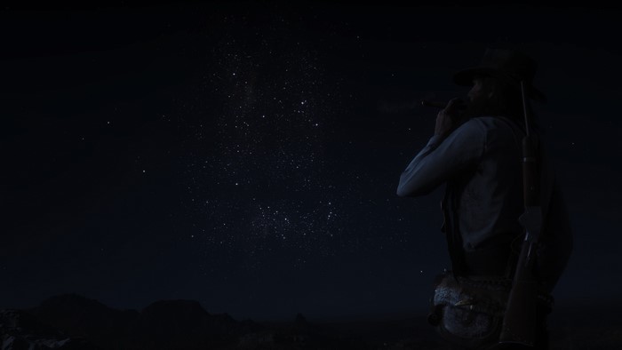 Man smoking cigar under starry sky in Red Dead Redemption 2