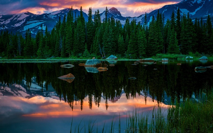 Mountain lake reflection at sunset