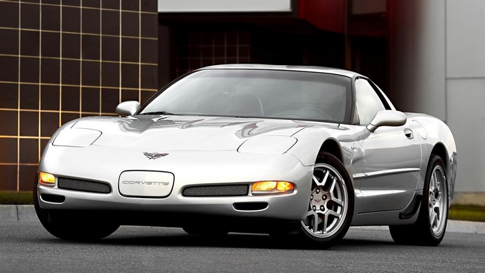 Silver Chevrolet Corvette C5 Z06 parked outside building