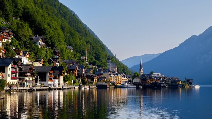 Hallstatt village on a lake with mountains and forest