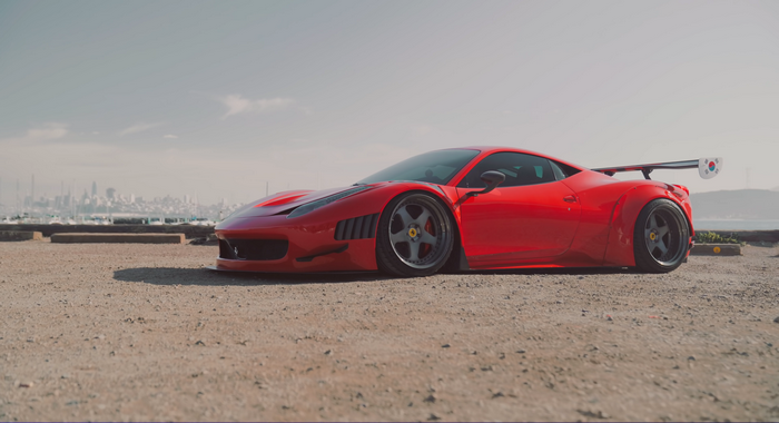 Red Ferrari 458 with a large rear spoiler