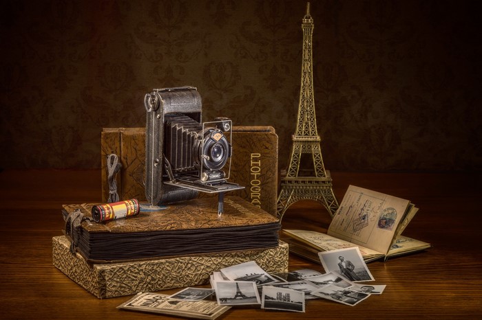 Vintage camera and Eiffel Tower souvenir