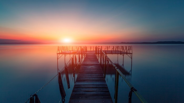 Wooden pier on a lake at sunset, Hungary