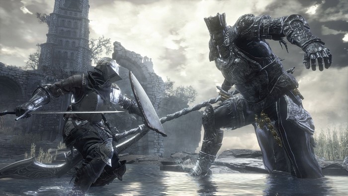 Knight fighting a large armored figure in Dark Souls 3
