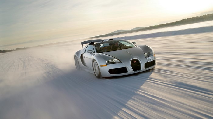 Bugatti Veyron driving on a snowy road