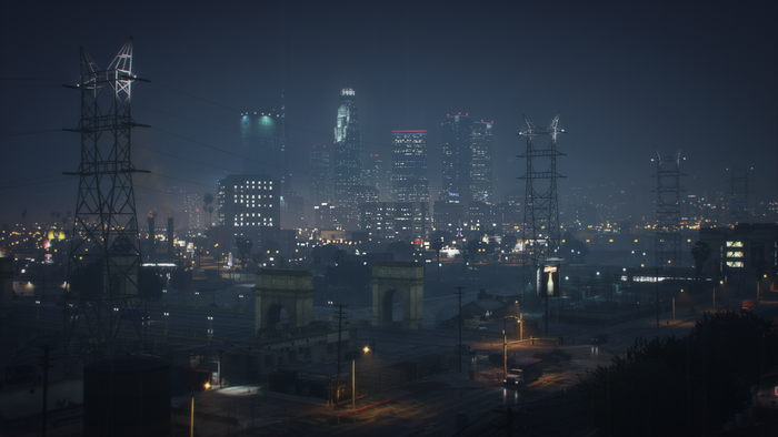 Nighttime Los Santos cityscape with power lines and arches