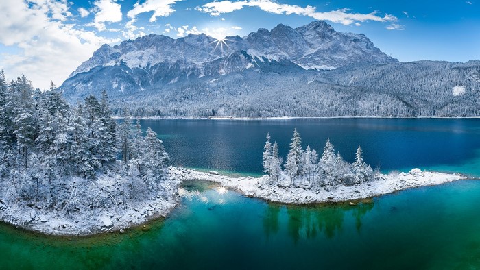 Snowy mountains and forest at Lake Eibsee, Germany