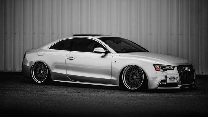 Silver Audi A5 Coupe with custom wheels