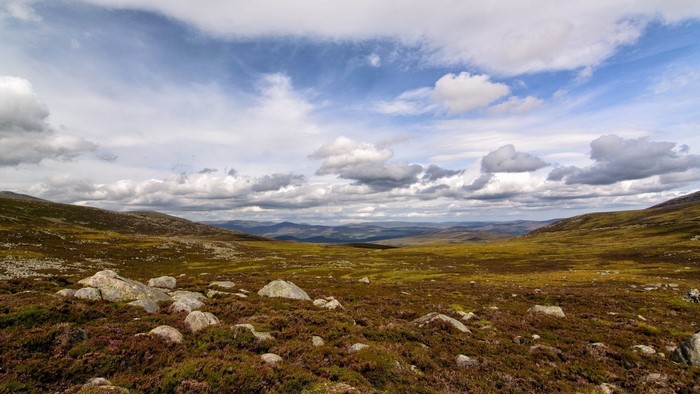 Hills and clouds over a rocky moorland landscape