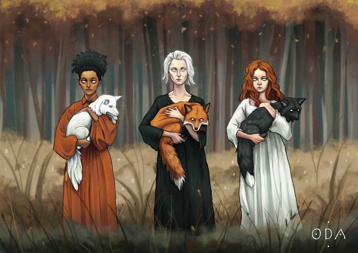 Three women holding foxes in a forest