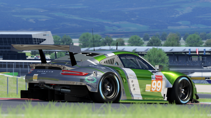Porsche 911 RSR race car with green and silver livery