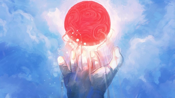 Hands holding a glowing red orb against a blue sky