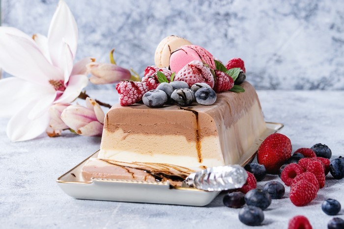 Tricolor ice cream loaf with berries and flowers