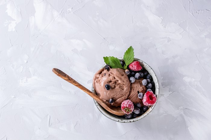 Chocolate ice cream with berries and mint