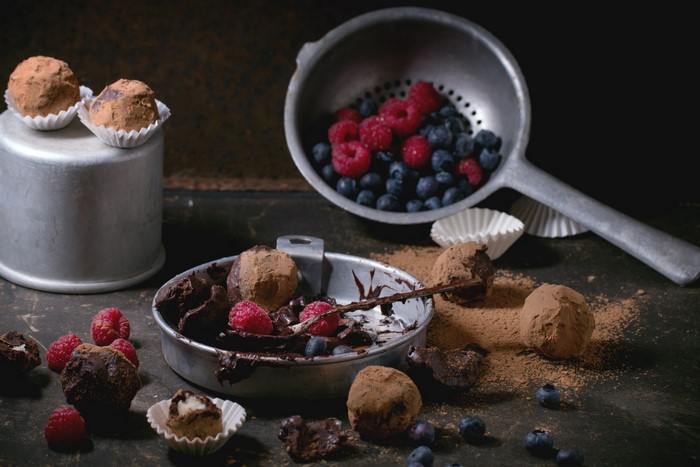 Chocolate truffles with raspberries and blueberries