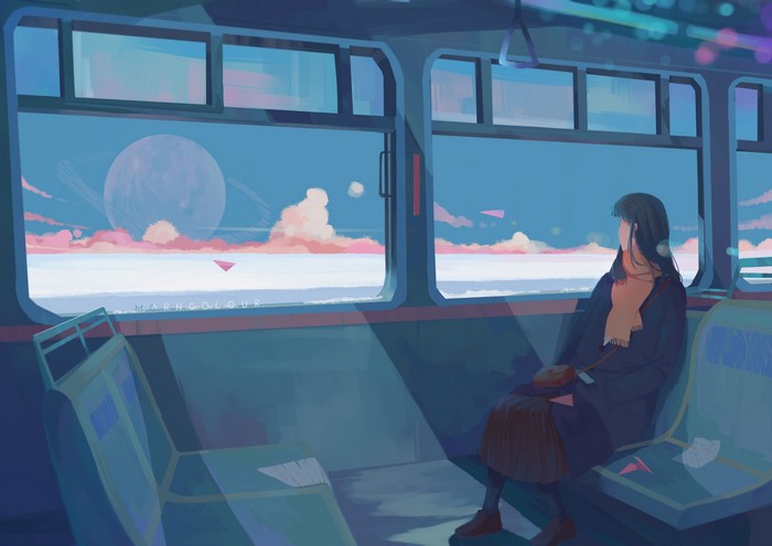 Woman traveling on a train looking out the window