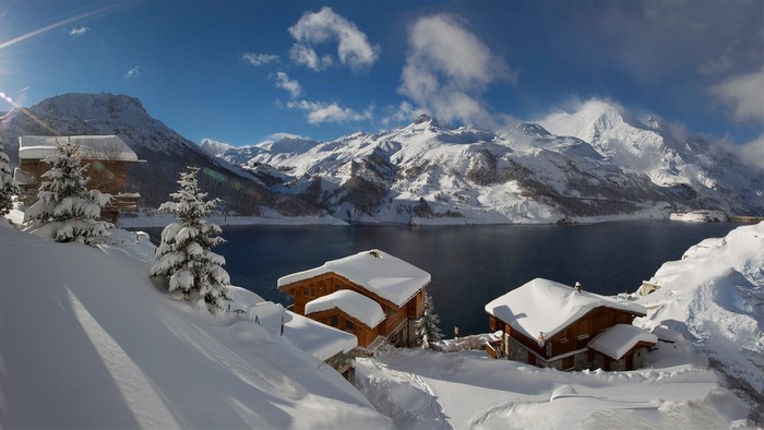 Snowy mountain village by Lac du Chevril, France