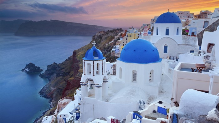Santorini, Greece: Blue Domes and Caldera at Sunset