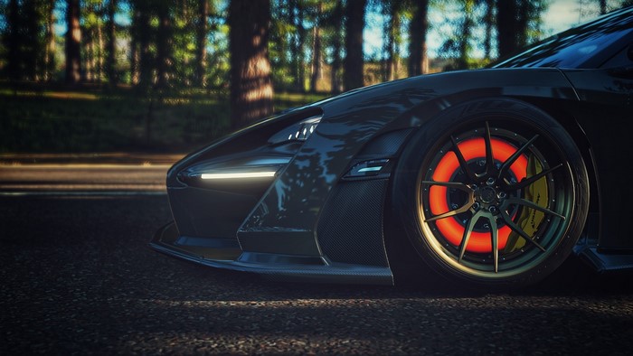McLaren Senna with glowing brakes on a road