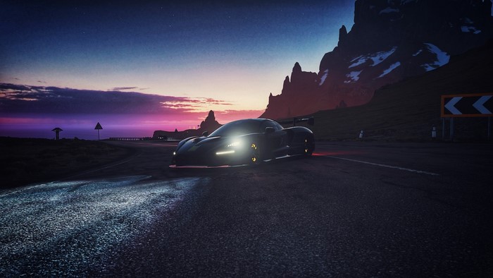 Black McLaren Senna on a mountain road at sunset