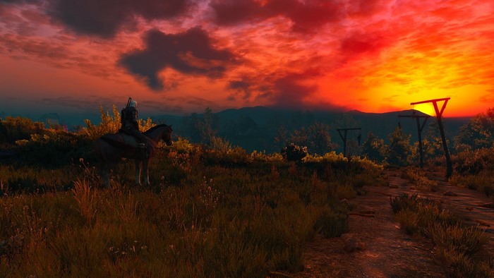 Geralt on horseback at sunset in The Witcher 3