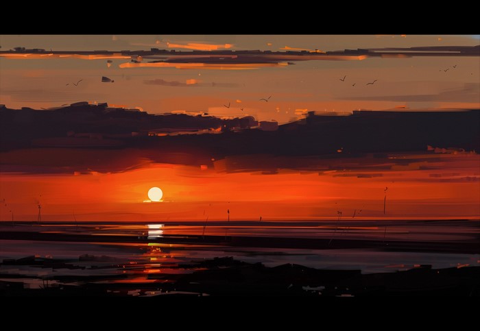 Sunset over water with birds and clouds