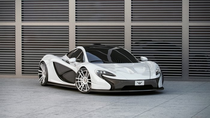White McLaren P1 supercar parked in front of a modern building