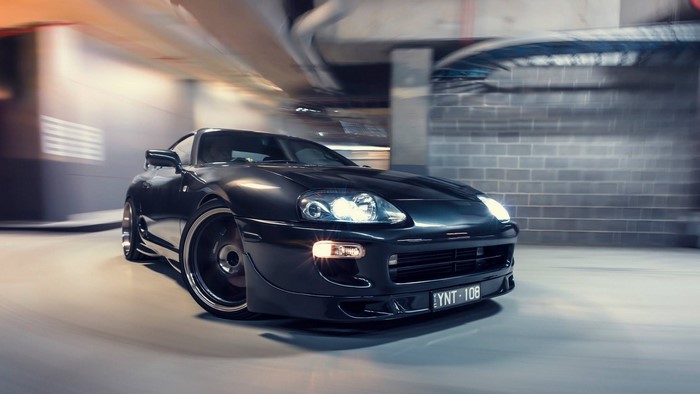 Black Toyota Supra MK4 in motion blur