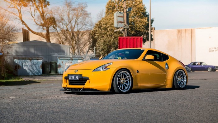 Yellow Nissan 370Z sports car with custom wheels