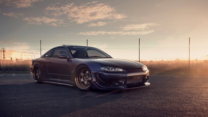 Purple Nissan Silvia S15 sports car at sunset
