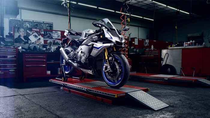 Yamaha R1M motorcycle on a lift in a garage