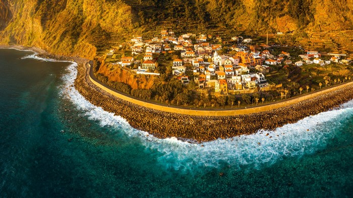 Aerial view of a coastal village in Madeira, Portugal at sunset