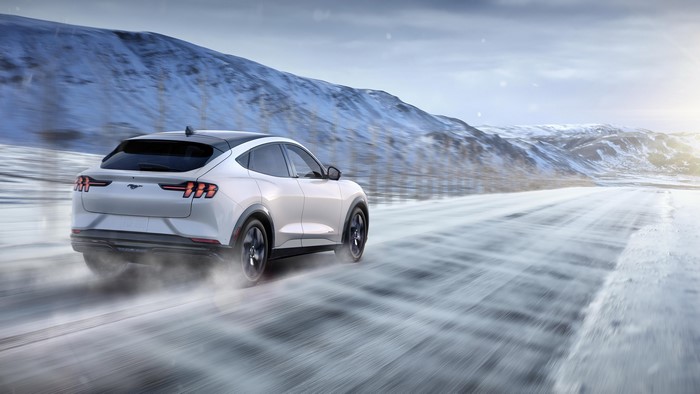 Ford Mustang Mach-E driving on a snowy road
