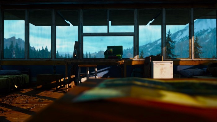 Days Gone screenshot inside a cabin with mountain view
