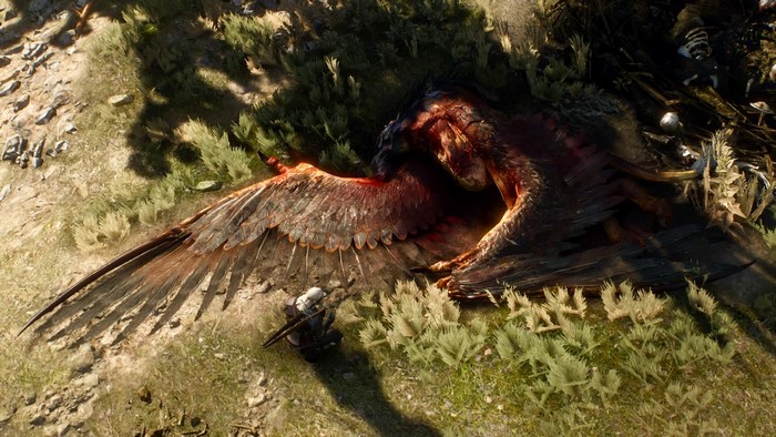 Geralt of Rivia with a dead Griffin in The Witcher 3