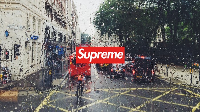 Supreme logo on a rainy London street