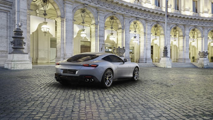 Ferrari Roma parked in front of a historic building