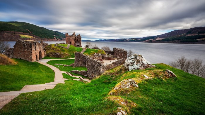 Urquhart Castle ruins on the shore of a lake in Scotland