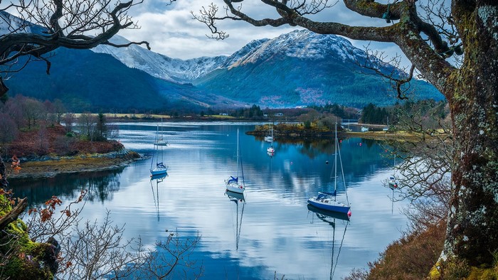 Sailboats on Loch Leven, Scotland with Snow-Capped Mountains
