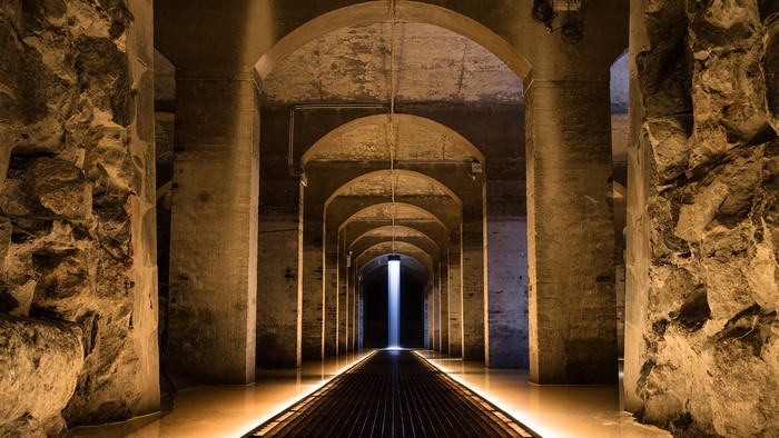 Underground Cistern Hallway with Light Beam