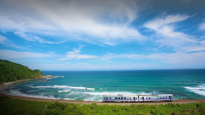 Train traveling along the coast of Shimane Prefecture, Japan