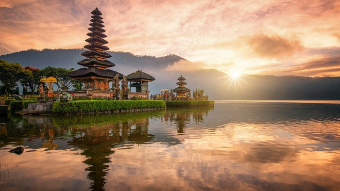 Ulun Danu Beratan Temple at sunrise on a lake in Bali, Indonesia