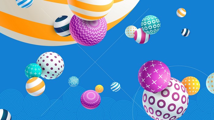 Colorful patterned balls floating on blue background